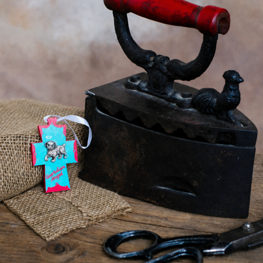 Hand-painted Guardian Angel for a dog, a small wooden cross ornament in turquoise and pink wrapped in burlap, made in British Columbia